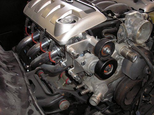 2004 LS1 GTO motor showing headers, motor mount kit and AC relocation bracket