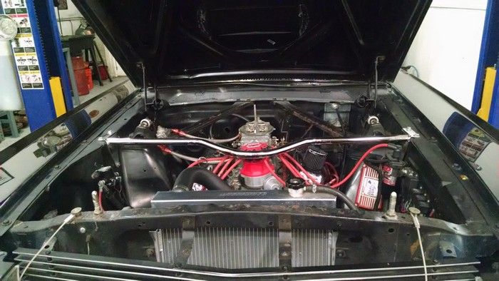 1966 Ford Mustang hood up engine view