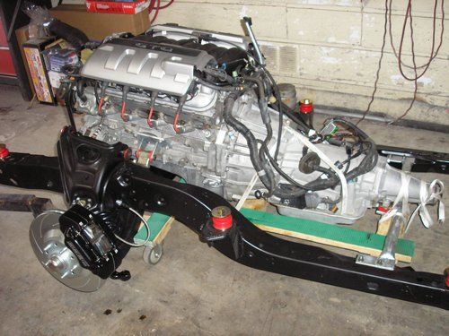 2004 LS1 GTO motor and 69 Camero drive train ready to go under the car.