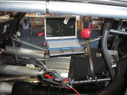 Outlaw 1966 Nova, inside of car showing laptop and cooling chamber.