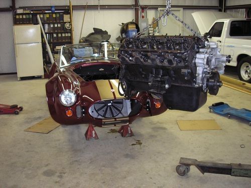 engine on hoist, front of car, 1966 shelby cobra